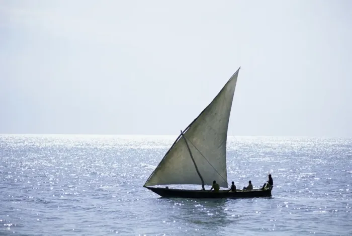 Framed Print : Dhow in silhouette on the Indian Ocean, off Stone Town, Zanzibar, Tanzania