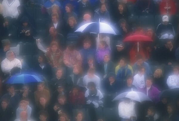 Diffuser filter used on shot of Wimbledon crowd in the rain, London, England