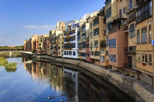Distinctive historic colourful arcaded houses and Onyar River, Girona, Girona Province