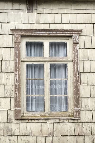 Distinctive wooden tiles around a window in Chiloe Island, Northern Patagonia, Chile
