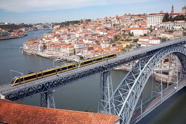 The Dom Luis 1 Bridge over the River Douro showing Porto Metro light rail in transit and Arrabida Bridge in background, Porto (Oporto), Portugal, Europe