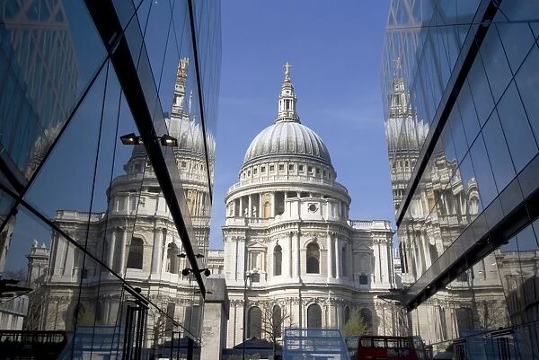 The dome of St. Pauls Cathedral reflected in glass walls, London, England