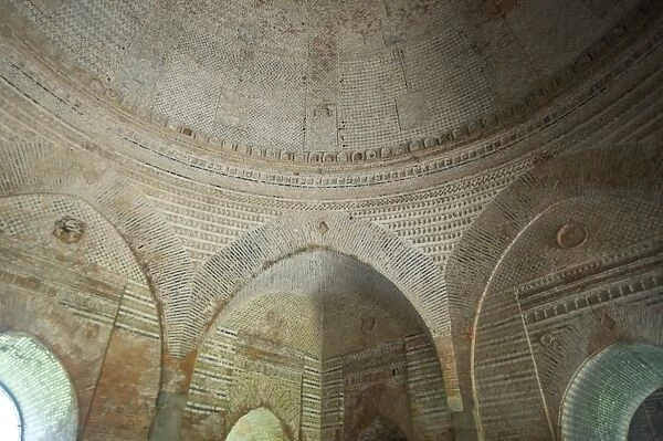 Domed interior and arches of the 15th century Lattan mosque, showing alternating horizontal bands of bricks, Gaur, West Bengal
