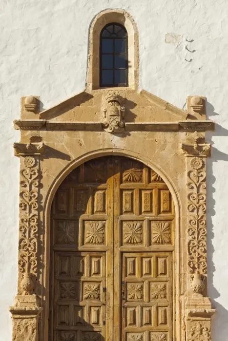 Framed Print : Doorway of beautiful 17th century Santa Maria Cathedral in this historic former capital, Betancuria, Fuerteventura, Canary Islands, Spain, Europe Framed Print : Doorway of beautiful 17th century Santa Maria Cathedral in this historic former capital, Betancuria, Fuerteventura, Canary Islands, Spain, Europe