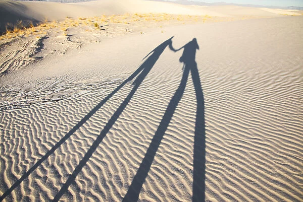 Two dorks playing with shadows in White Sands National Park, New Mexico