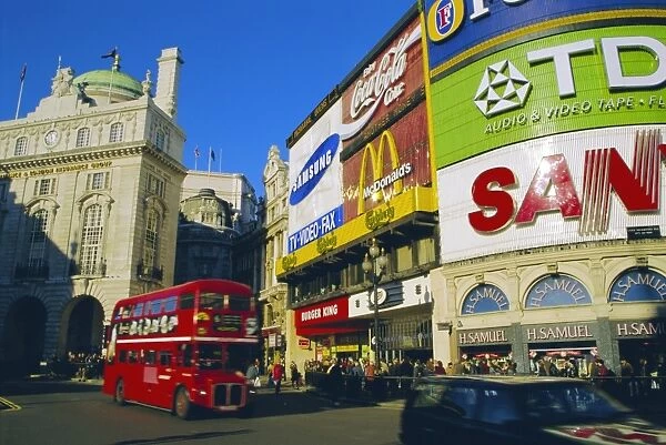 Double decker bus and advertisements, Piccadilly Circus, London, England, UK