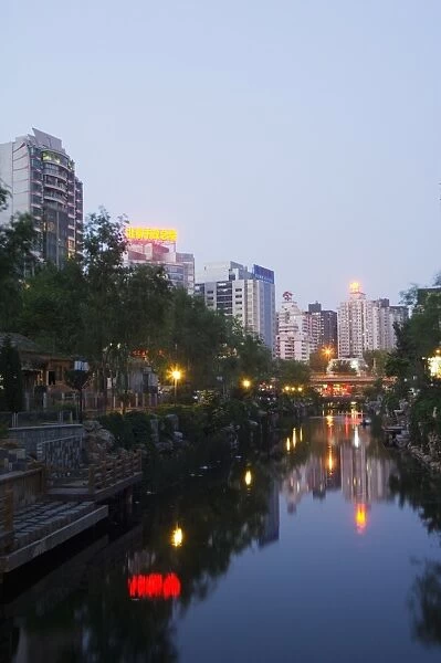 Downtown buildings illuminated in Xizhimen area of Beijing, China, Asia