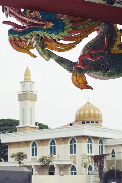 Dragon and mosque at Sam Kow Tong Chinese Temple, Kuala Lumpur, Malaysia