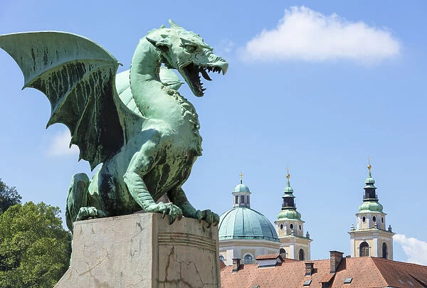 Dragon statue on the Dragon Bridge (Zmajski most) in front of the Ljubljana Cathedral