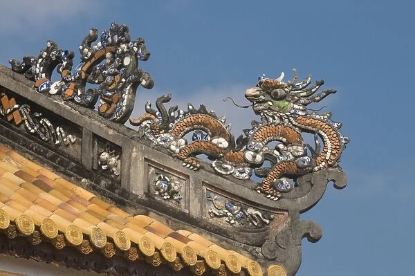 Dragons on top of the roof of the Halls of the Mandarins, Hue, Vietnam