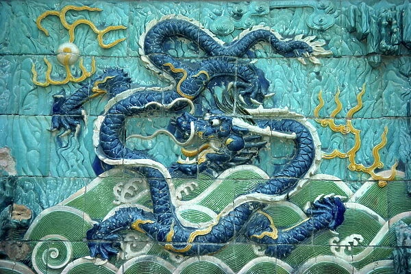Dragons on tiles on the Dragon wall in the Forbidden City in Beijing, China, Asia