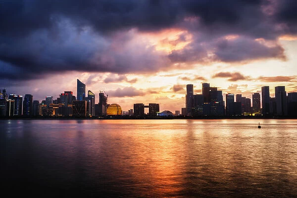 Dramatic clouds over Qianjiang River with skyline of Hangzhous new business district