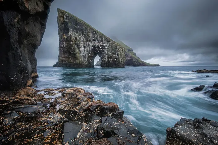 Framed Print : Dramatic Sea Arch of Drangarnir and waves crashing on the Faroe Islands coast, Faroe Islands, Denmark, Atlantic, Europe Framed Print : Dramatic Sea Arch of Drangarnir and waves crashing on the Faroe Islands coast, Faroe Islands, Denmark, Atlantic, Europe