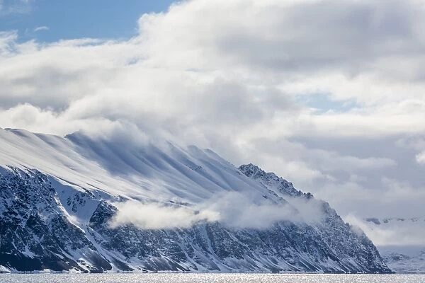 Dramatic skies in Signehamna, Krossfjorden, Spitsbergen, Svalbard, Norway, Scandinavia, Europe