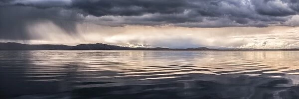Dramatic storm clouds over Lake Titicaca, Peru, South America