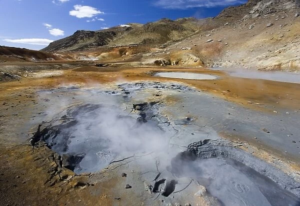 Dramatic volcanic landscape with boiling mudpools in geothermal area on Reykjanes Peninsula