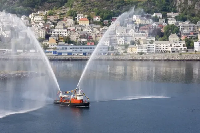 Framed Print : Dressed overall, with the traditional farewell display, the fireboat at Alesund Framed Print : Dressed overall, with the traditional farewell display, the fireboat at Alesund