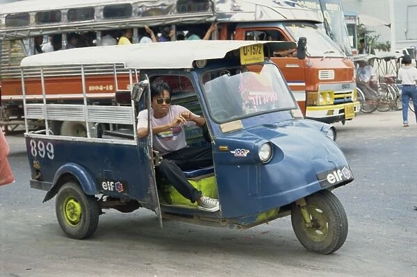 Driver of local transport vehicle on the road in Ayutthaya