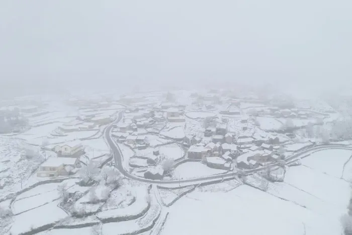 Framed Print : Drone aerial view of a road and remote village covered with snow in Vila Real, Norte Framed Print : Drone aerial view of a road and remote village covered with snow in Vila Real, Norte