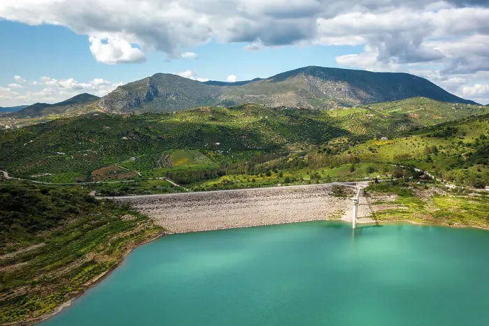 Framed Print : Drone aerial view of Zahara de la Sierra water reservoir dam with turquoise water and mountains in the background, Andalusia, Spain, Europe