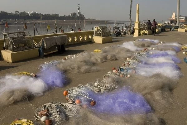 Drying the nets at the fishing harbour on the Daman Ganga River, Daman, Gujarat, India, Asia
