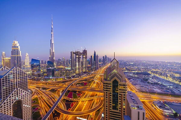 Dubai skyline with Burj Khalifa and Sheikh Zayed Road Interchange, Dubai, United Arab Emirates