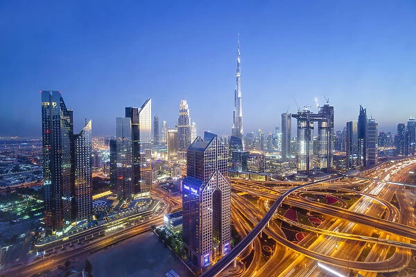 Dubai skyline with Burj Khalifa and Sheikh Zayed Road Interchange, Dubai, United Arab Emirates