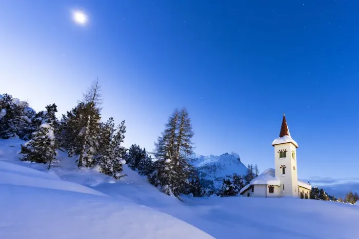 Framed Print : Dusk over Chiesa Bianca in the snowy landscape lit by moon, Maloja, Bregaglia Valley