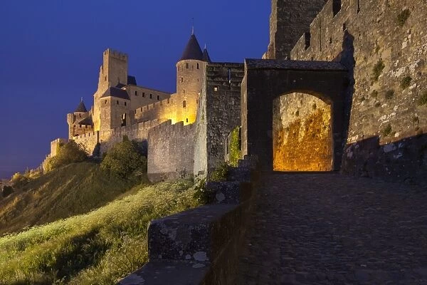 Dusk at the entrance to La Cite in Carcassonne, UNESCO World Heritage Site, Languedoc-Roussillon, France, Europe