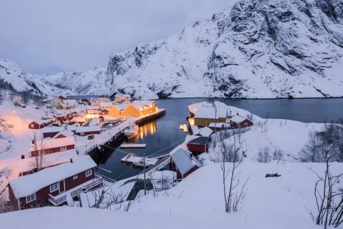 Framed Print : Dusk lights on the fishing village surrounded by snowy peaks, Nusfjord, Nordland Framed Print : Dusk lights on the fishing village surrounded by snowy peaks, Nusfjord, Nordland