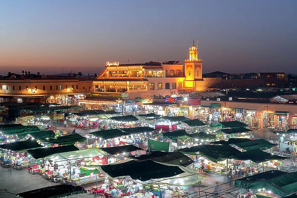 Dusk lights over the iconic markets in Jemaa el Fna square, UNESCO World Heritage Site, Marrakech, Morocco, North Africa, Africa