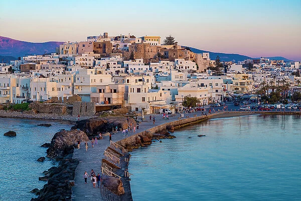 Dusk over Naxos town and causeway to The Porta Gateway, part of the unfinished Temple of Apollo, Naxos, the Cyclades, Aegean Sea, Greek Islands, Greece, Europe