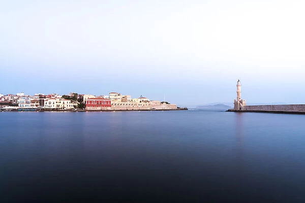 Dusk over the Venetian lighthouse and harbour of Chania old town, Crete, Greek Islands