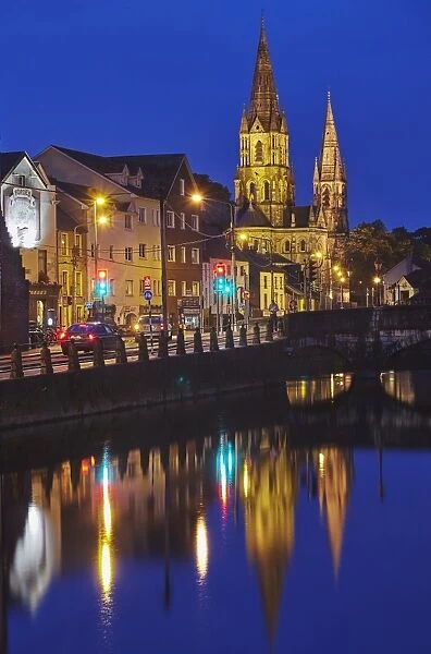 A dusk view of St. Fin Barres Cathedral, on the banks of the Lee River, in Cork