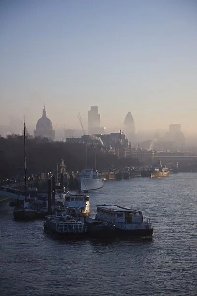 Early morning fog hangs over St. Pauls and the City of London skyline