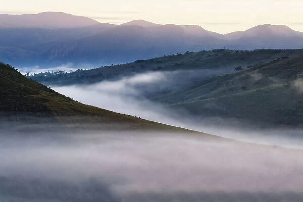 Early morning fog over valleys and mountains, Serra da Canastra, Minas Gerais state, Brazil, South America