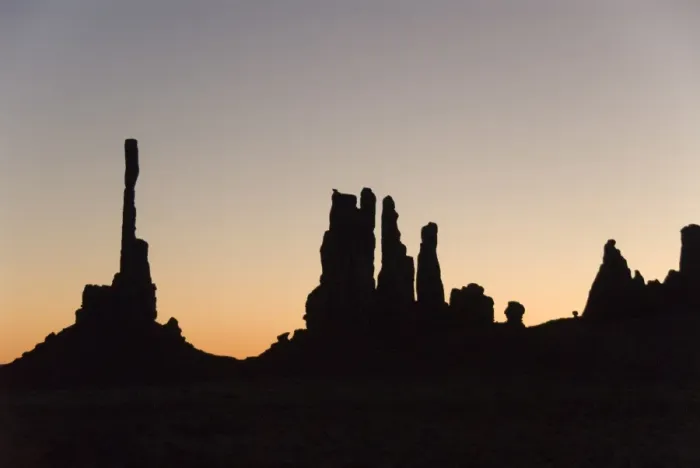 Framed Print : Early morning silhouette of the Totem Pole on the left, and Yei Bi Chei on the right Framed Print : Early morning silhouette of the Totem Pole on the left, and Yei Bi Chei on the right