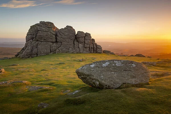 The early morning winter sunrise illuminates the rocks of Haytor, Dartmoor, Devon
