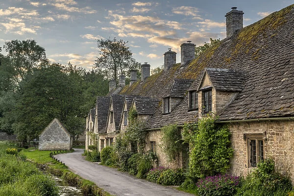 Early Spring morning view of the beautiful Cotswolds cottages at Arlington Row in Bibury