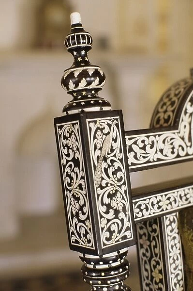 Ebony wood and ivory inlay detail on one of the pair of throne chairs
