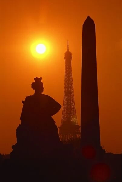 The Eiffel Tower, the Luxor Obelisk, 3200 years old, from Egypt, and the Strasbourg statue silhouetted at sunset, Place de la Concorde, Paris
