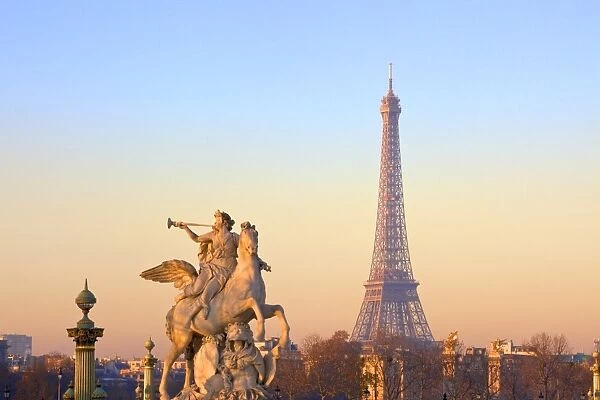 Eiffel Tower from Place de La Concorde with statue in foreground, Paris, France, Europe