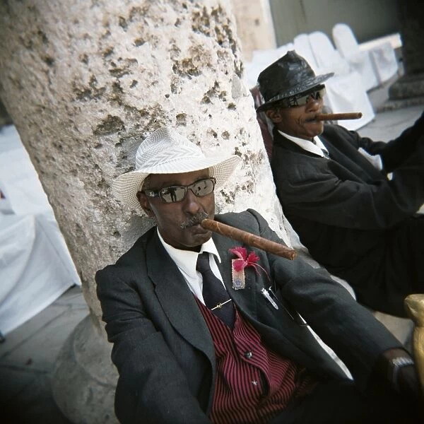 Elderly men posing with cigars, Havana, Cuba, West Indies, Central America