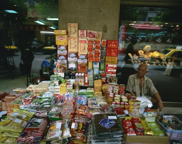 Framed Print : Elderly street trader with his stall in Bangkok Framed Print : Elderly street trader with his stall in Bangkok