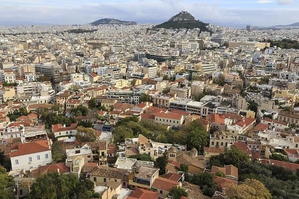 Elevated Athens city view from the Acropolis, towards Lykavittos Hill and Parliament across Plaka