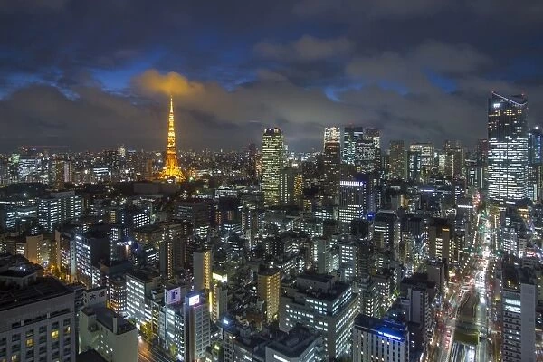 Elevated night view of the city skyline and iconic illuminated Tokyo Tower, Tokyo