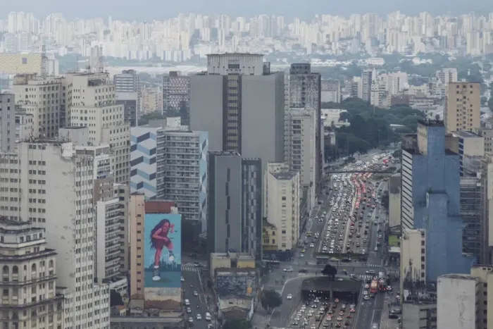 Framed Print : Elevated view of downtown skyscrapers, heavy traffic on Avenue Prestes Maia, rainy season sky, Sao Paulo, Brazil, South America