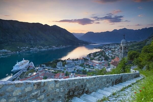 Elevated view over Kotors Stari Grad (Old Town) and The Bay of Kotor at sunset, Kotor, UNESCO World Heritage Site, Montenegro, Europe