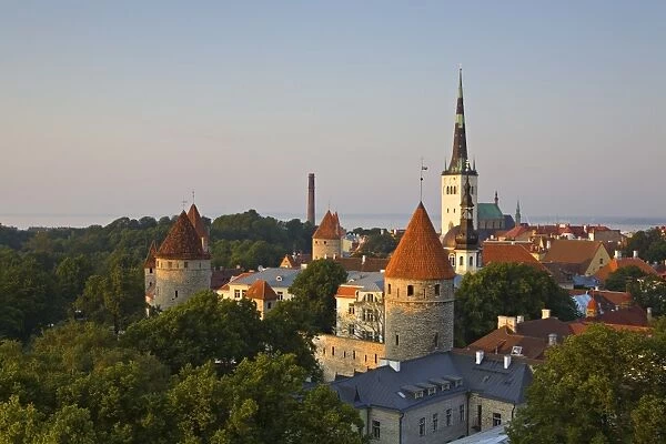 Elevated view of lower Old Town with Oleviste Church in the background, UNESCO World Heritage Site, Tallinn, Estonia, Europe
