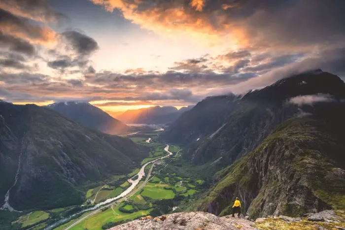 Framed Print : Elevated view of man standing on Romsdalseggen ridge admiring Rauma valley during sunset Framed Print : Elevated view of man standing on Romsdalseggen ridge admiring Rauma valley during sunset